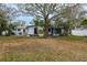 Home's back view, large backyard, mature tree at 2744 45Th S St, Gulfport, FL 33711