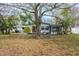 Home's back view, large backyard, mature tree at 2744 45Th S St, Gulfport, FL 33711