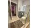 Bathroom with gray vanity, toilet, and a glass-enclosed shower at 3005 E 148Th Ave, Lutz, FL 33559