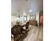 Bright dining area with hardwood floors and an ornate buffet at 3005 E 148Th Ave, Lutz, FL 33559