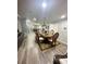 Elegant dining room with a large table, chandelier, and hardwood floors at 3005 E 148Th Ave, Lutz, FL 33559