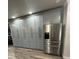 Spacious kitchen with gray cabinets and stainless steel appliances at 3005 E 148Th Ave, Lutz, FL 33559