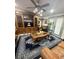 Living room featuring a large entertainment center and leather seating at 3005 E 148Th Ave, Lutz, FL 33559
