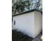 White storage building with a paved pathway and landscaping at 3005 E 148Th Ave, Lutz, FL 33559