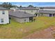 Aerial view of house and neighboring homes at 30148 Fedora Cir, Brooksville, FL 34602