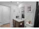 Bathroom with vanity, toilet, and decorative accents at 30148 Fedora Cir, Brooksville, FL 34602