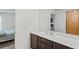 Bathroom with vanity, sink, and view into bedroom at 30148 Fedora Cir, Brooksville, FL 34602