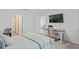 Spacious bedroom with a desk and view into another room at 30148 Fedora Cir, Brooksville, FL 34602