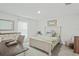 Bright bedroom with a comfortable bed and built-in desk at 30148 Fedora Cir, Brooksville, FL 34602