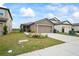 One-story house with a two-car garage and a well-maintained front yard at 30148 Fedora Cir, Brooksville, FL 34602