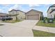 House exterior featuring a two-car garage and driveway at 30148 Fedora Cir, Brooksville, FL 34602