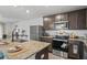 Modern kitchen with stainless steel appliances and granite countertops at 30148 Fedora Cir, Brooksville, FL 34602