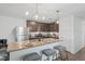 Modern kitchen with island, stainless steel appliances, and granite countertops at 30148 Fedora Cir, Brooksville, FL 34602