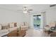 Living room with hardwood floors and access to the patio at 30148 Fedora Cir, Brooksville, FL 34602