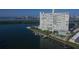 Aerial view of waterfront highrise building with pool and boat slips at 31 Island Way # 303, Clearwater Beach, FL 33767