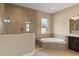 Elegant bathroom with soaking tub and walk-in shower at 32202 Summerglade Dr, Wesley Chapel, FL 33545
