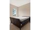 Bedroom with dark wood platform bed at 32202 Summerglade Dr, Wesley Chapel, FL 33545