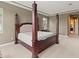 Luxurious Primary suite with a large bed and ensuite bathroom at 32202 Summerglade Dr, Wesley Chapel, FL 33545