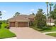 Attractive single-story home with a two-car garage and manicured lawn at 32202 Summerglade Dr, Wesley Chapel, FL 33545