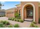 Front entry featuring a brick walkway and double doors at 32202 Summerglade Dr, Wesley Chapel, FL 33545