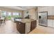 Island kitchen with stainless steel appliances and granite countertops at 32202 Summerglade Dr, Wesley Chapel, FL 33545