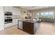 Open concept kitchen with island and stainless steel appliances at 32202 Summerglade Dr, Wesley Chapel, FL 33545
