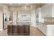 Spacious kitchen with granite island, white cabinets, and stainless steel appliances at 32202 Summerglade Dr, Wesley Chapel, FL 33545