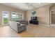 Open living area with large sectional sofa and views to backyard at 32202 Summerglade Dr, Wesley Chapel, FL 33545
