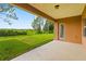 Covered patio overlooking the backyard at 32202 Summerglade Dr, Wesley Chapel, FL 33545