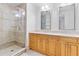 Elegant bathroom with double vanity, large mirror, and shower at 331 Cleveland St # 315, Clearwater, FL 33755