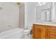 Clean bathroom with tile shower, vanity, and toilet at 331 Cleveland St # 315, Clearwater, FL 33755