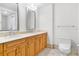 Bathroom boasts double sinks, wood cabinets, and a toilet at 331 Cleveland St # 315, Clearwater, FL 33755