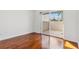 Bedroom with hardwood floors and sliding glass door to patio at 331 Cleveland St # 315, Clearwater, FL 33755