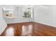 Bright living room with hardwood floors and large windows at 331 Cleveland St # 315, Clearwater, FL 33755