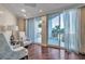 Bright lounge area with two armchairs and access to a balcony at 331 Cleveland St # 315, Clearwater, FL 33755