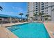 Resort-style pool with ample lounge chairs and shade at 331 Cleveland St # 315, Clearwater, FL 33755