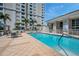 Inviting community pool with steps and surrounding patio at 331 Cleveland St # 315, Clearwater, FL 33755