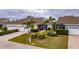 Property view showing home, landscaping, and neighboring homes at 5610 Golden Isles Dr, Apollo Beach, FL 33572