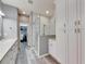 Spacious bathroom with double vanity, walk-in shower, and built-in storage at 5610 Golden Isles Dr, Apollo Beach, FL 33572
