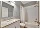 Clean bathroom, granite countertop, white cabinets, and a bathtub at 5610 Golden Isles Dr, Apollo Beach, FL 33572