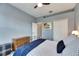 Comfortable bedroom with a metal bed frame and built-in closet at 5610 Golden Isles Dr, Apollo Beach, FL 33572