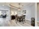 Elegant dining room with hardwood floors and a large table, offering ample seating at 5610 Golden Isles Dr, Apollo Beach, FL 33572