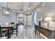 Bright dining area with hardwood floors, a table and chairs, and an open concept design at 5610 Golden Isles Dr, Apollo Beach, FL 33572