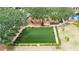 Artificial turf dog park with seating at 5610 Golden Isles Dr, Apollo Beach, FL 33572