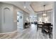 Open concept entryway with a view of the dining room and kitchen at 5610 Golden Isles Dr, Apollo Beach, FL 33572