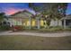 Charming two-story home with a screened porch and landscaped yard at 5610 Golden Isles Dr, Apollo Beach, FL 33572