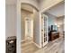 Bright hallway with access to bathroom and living area at 5610 Golden Isles Dr, Apollo Beach, FL 33572