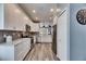 Modern kitchen with white cabinets and stainless steel appliances at 5610 Golden Isles Dr, Apollo Beach, FL 33572