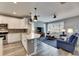 Modern kitchen with white cabinets, quartz counters, and stainless steel appliances at 5610 Golden Isles Dr, Apollo Beach, FL 33572