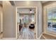 Spacious living area with hardwood floors and French doors at 5610 Golden Isles Dr, Apollo Beach, FL 33572